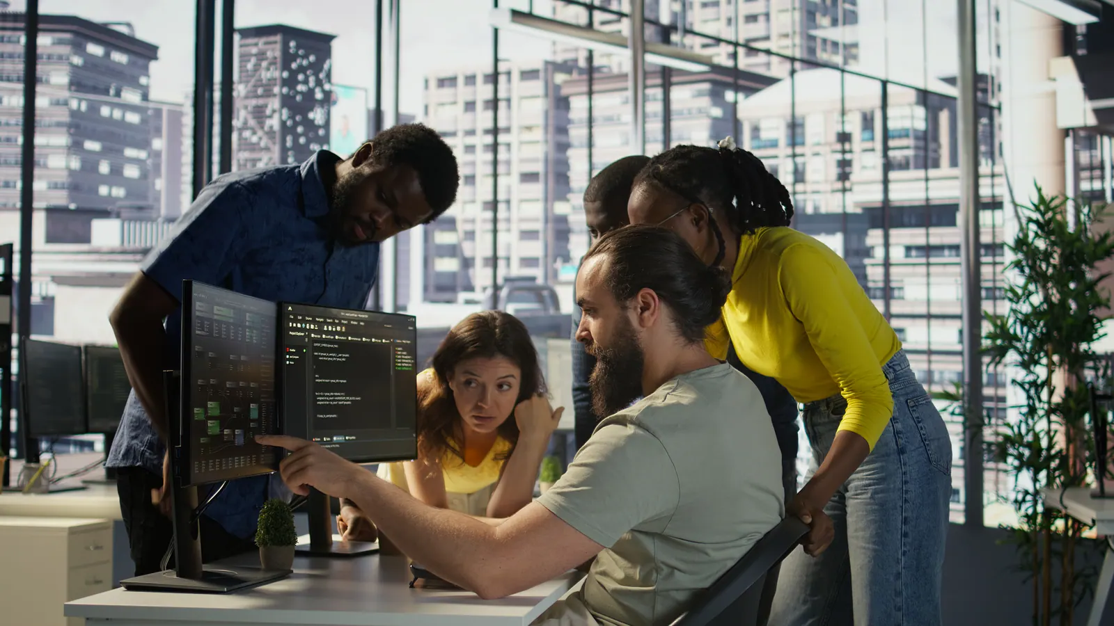 Software Development Concept Image - code on screen, team collaborating
